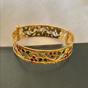 Elegant Gold Filigree Bracelet with Green and Red Accents. This bangle is 22 k.